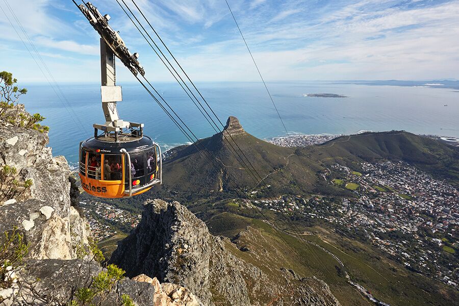 Table mountain cable car ride with view of lions head in Cape Town. Sightseeing while on a private golf and safari tour through South Africa.