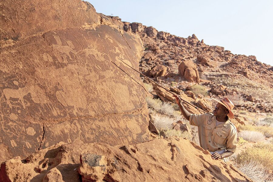 Sightseeing Ancient Caveman Rock Art in Namibia while on luxury safari with Premier Africa