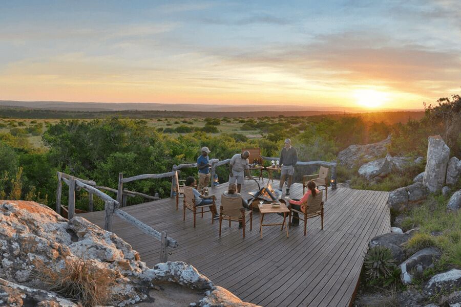 Sundowners with firepit on deck with stunning view of Shamwari Game Reserve, part exclusive luxury safari experience