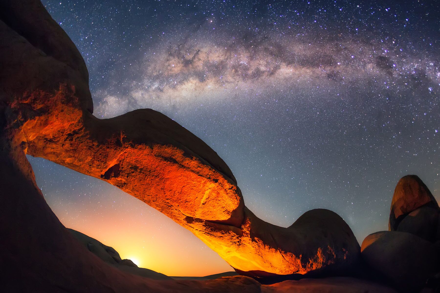 Stargazing with view of overhead spitzkoppe in the Sossusvlei in Namibia.