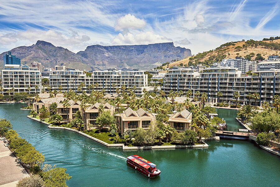 Sightseeing Table Mountain in Cape Town from balcony of luxury accommodation with lake view