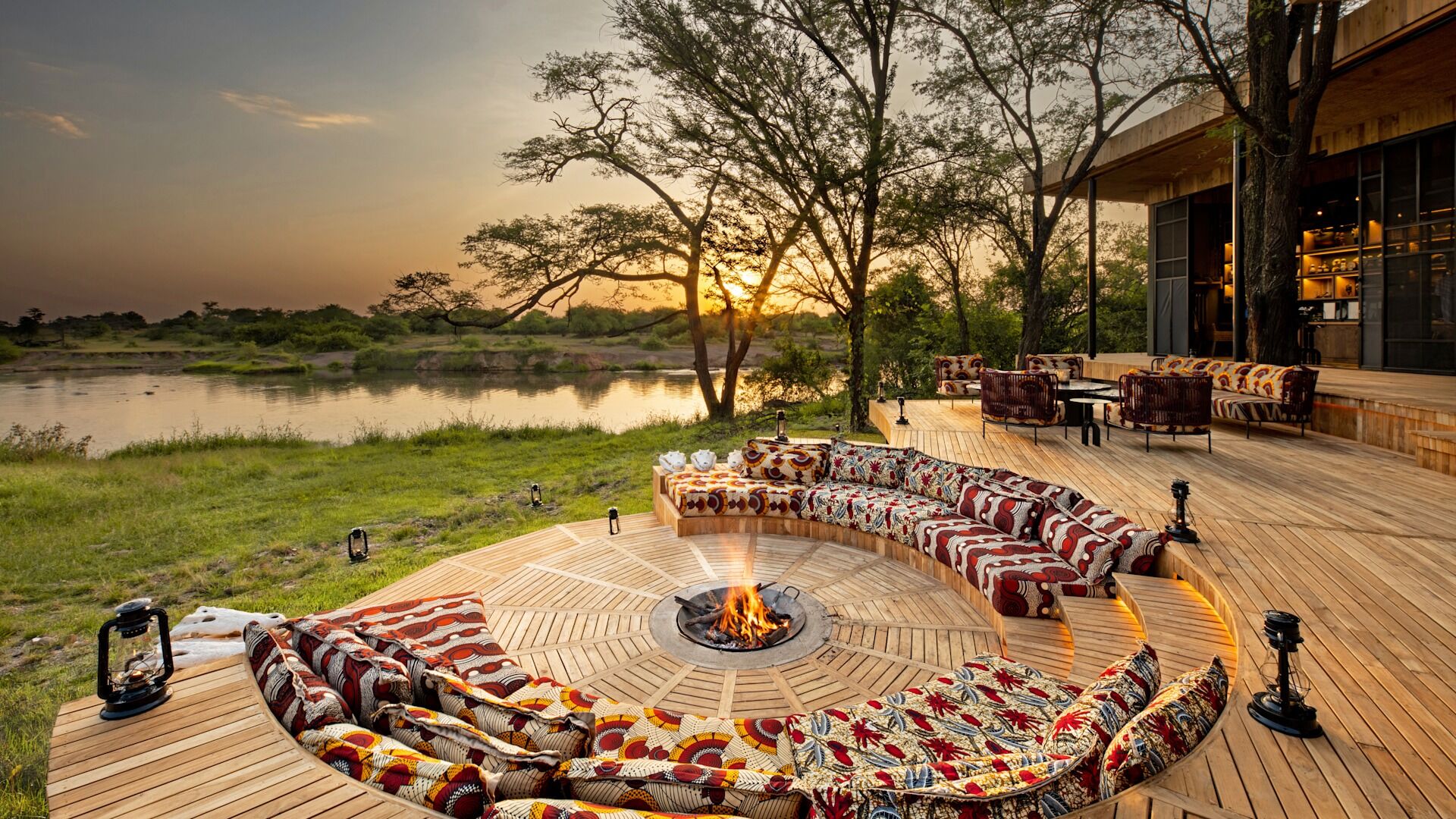 Tanzania-Grumeti-Serengeti-River-Lodge-Guest-Area-firepit-with-sunset
