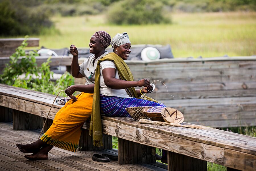 Locals making art work, part of cultural visit while on a luxury safari