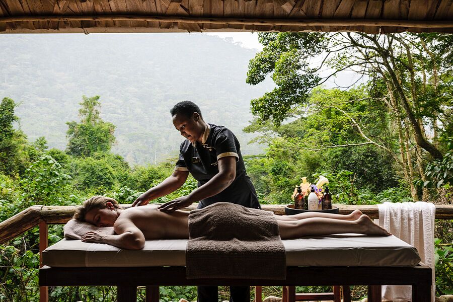 Massage on private deck with beautiful in Bwindi Impenetrable Forest while on a luxury safari in Africa.
