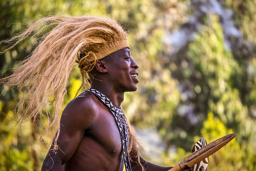 Cultural dancing in Volcanoes National Park while on an exclusive luxury safari with Premier Africa