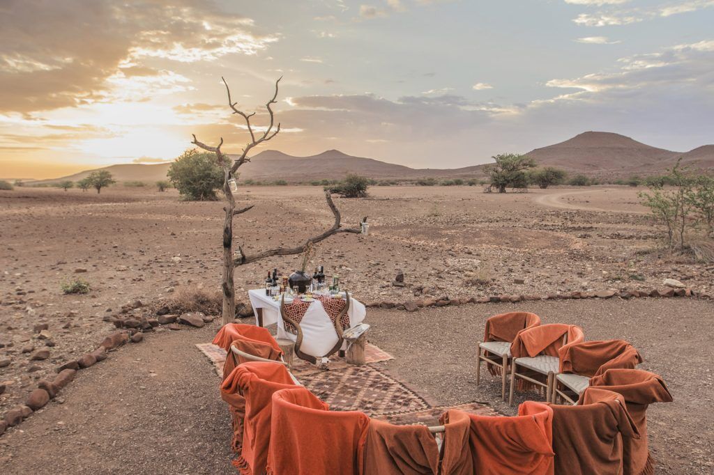Sundowners in the desert in Palmwag while on a luxury safari vacation with premier Africa
