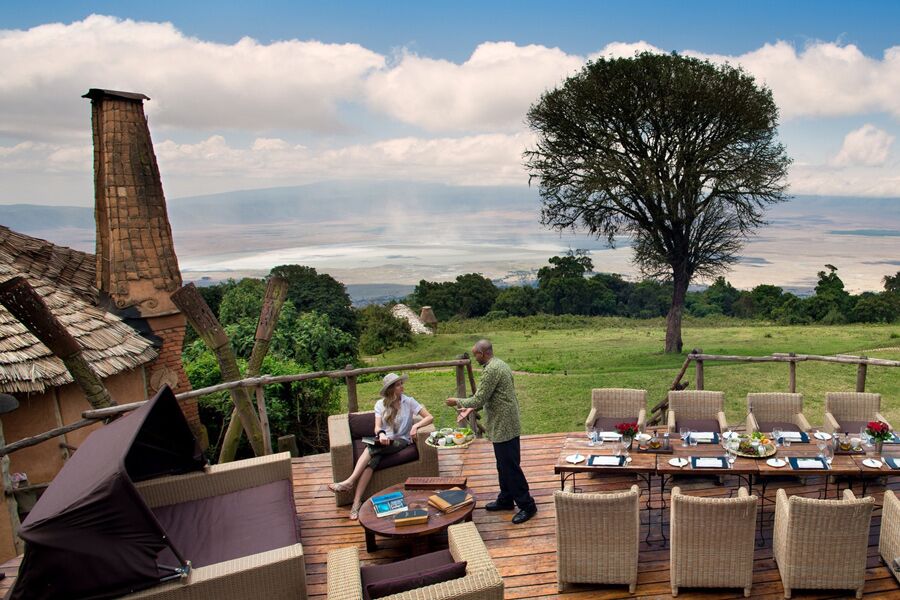 Guest having drink before lunch at andbeyond ngorongoro crater lodge