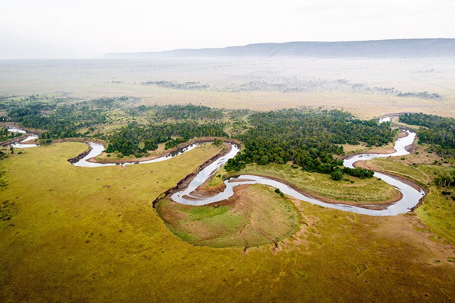 Aerial view of a delta from a private helicopter ride while on luxury safari in Masai Mara National Reserve