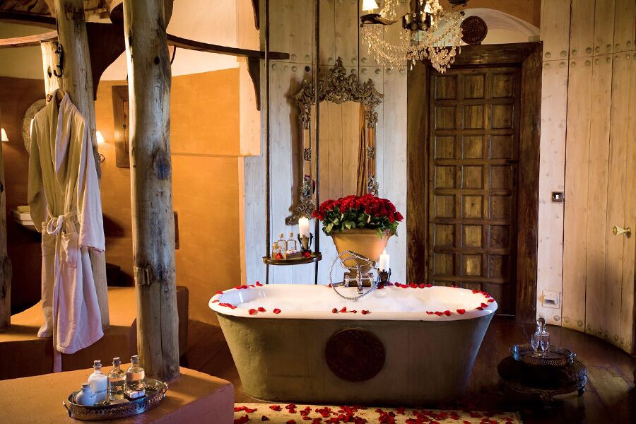 Luxury accommodation bathroom with roses and petals for honeymooners in Ngorongoro Conservation Area