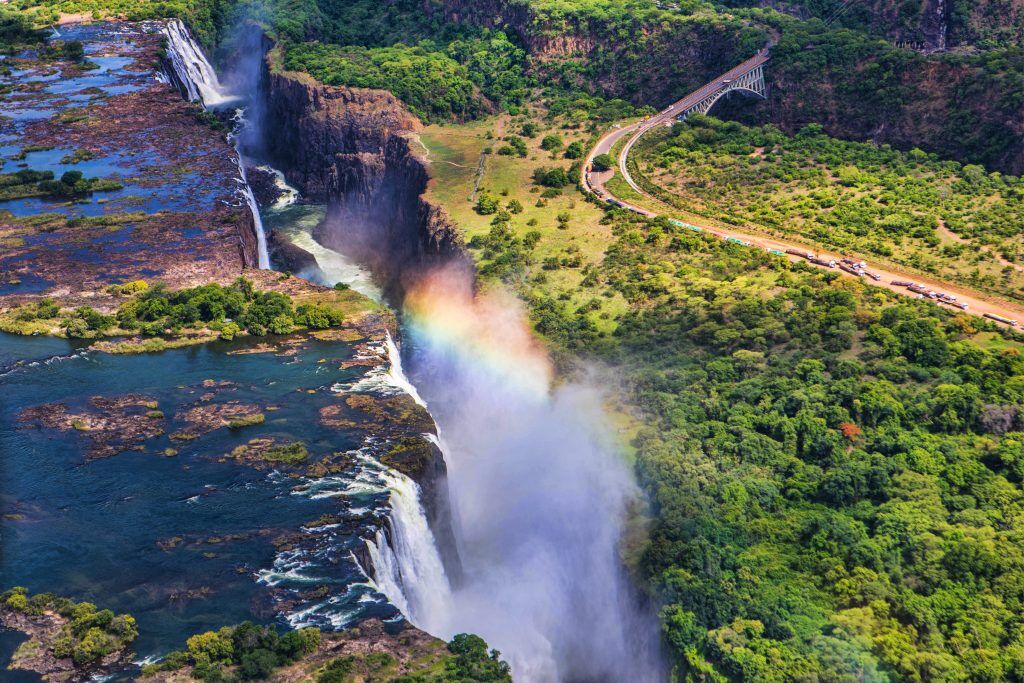 Rainbow,Over,Victoria,Falls,In,Zimbabwe,,Sunny,Day,In,Africa