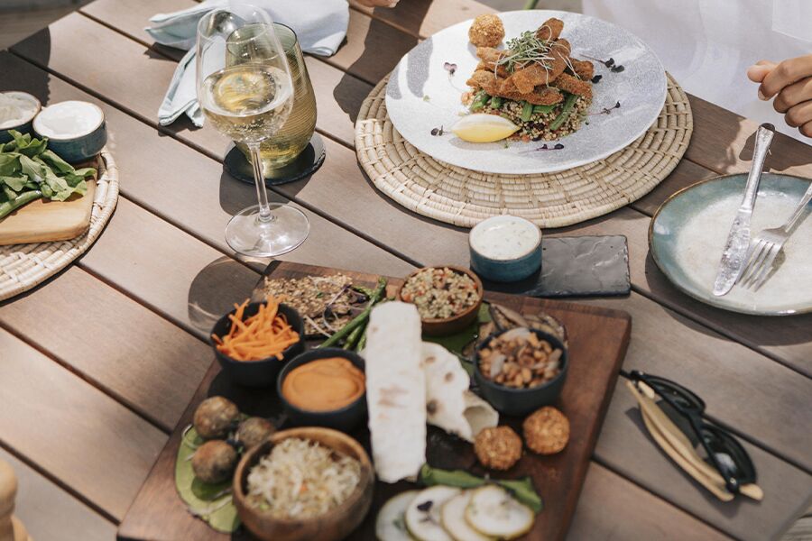 Fine dining cuisine and champagne at luxury accommodation in the Okavango Delta.